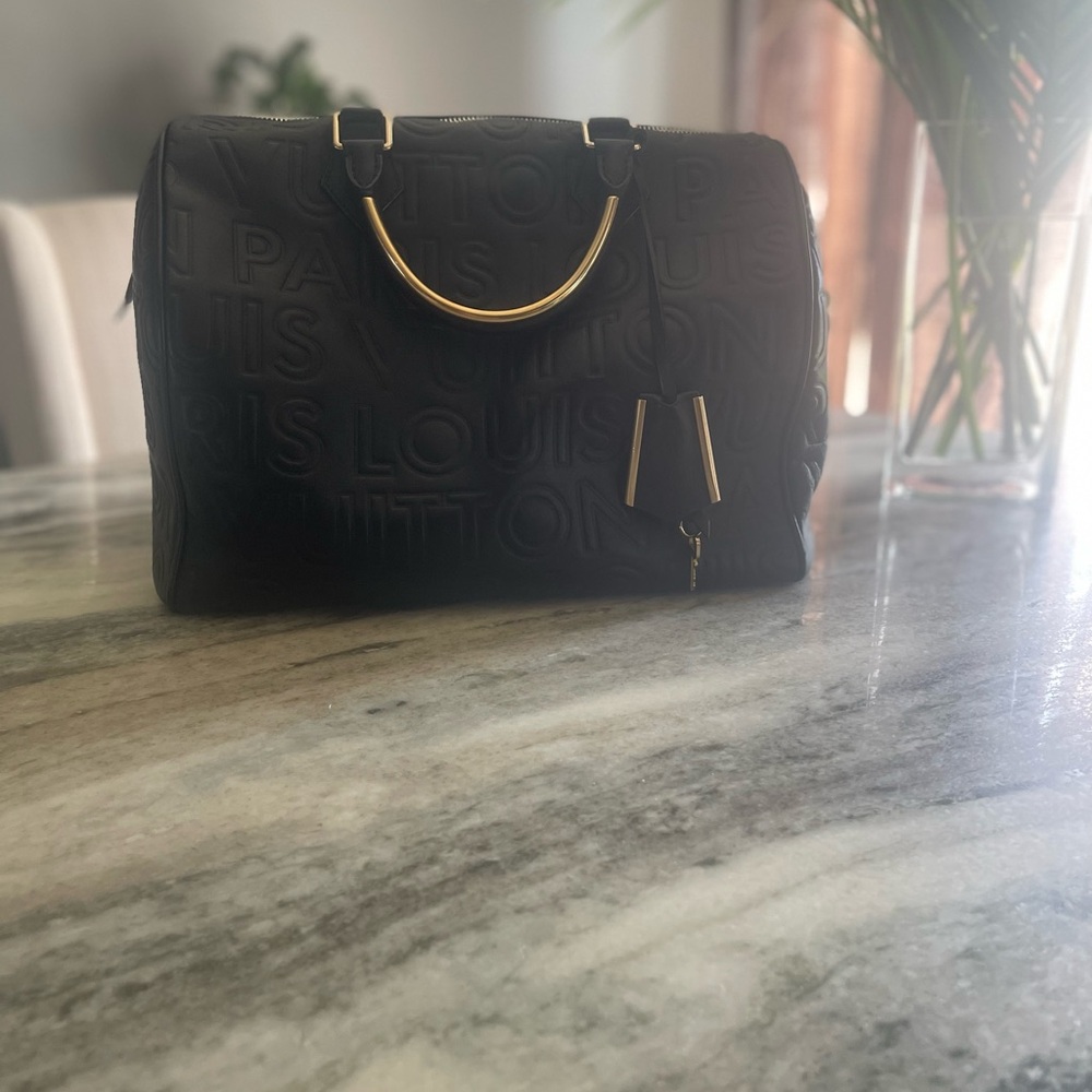 Louis Vuitton Authentic! Black and Gold Satchel with Elegant Design